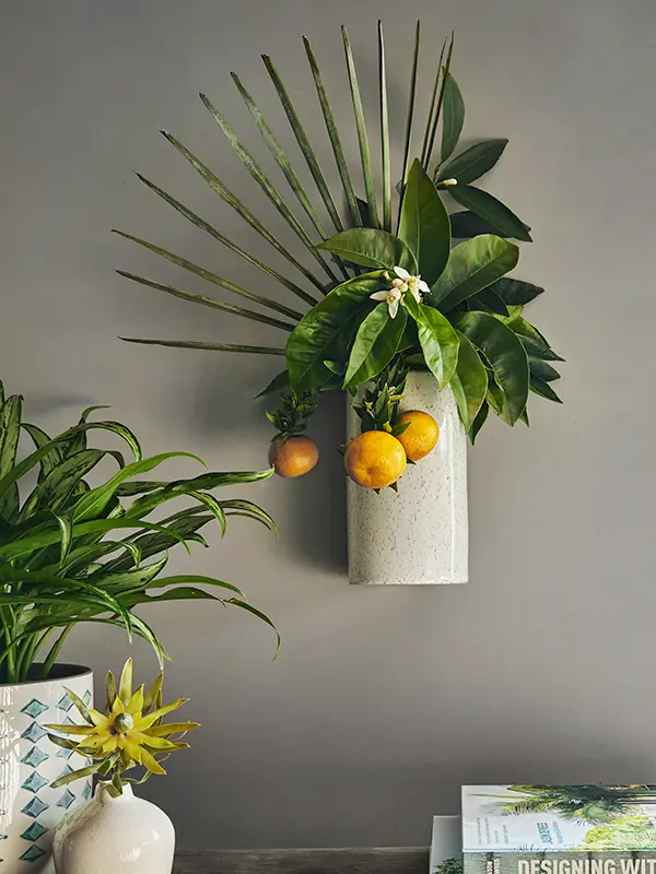 Flora Grubb Gardens: arreglo de palma y cítricos